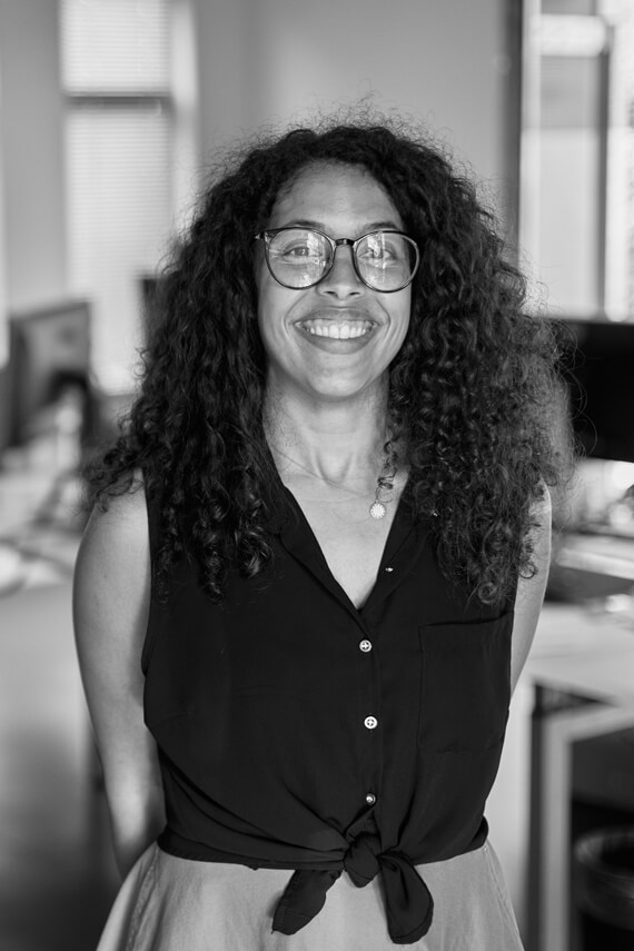 a woman smiling in the office